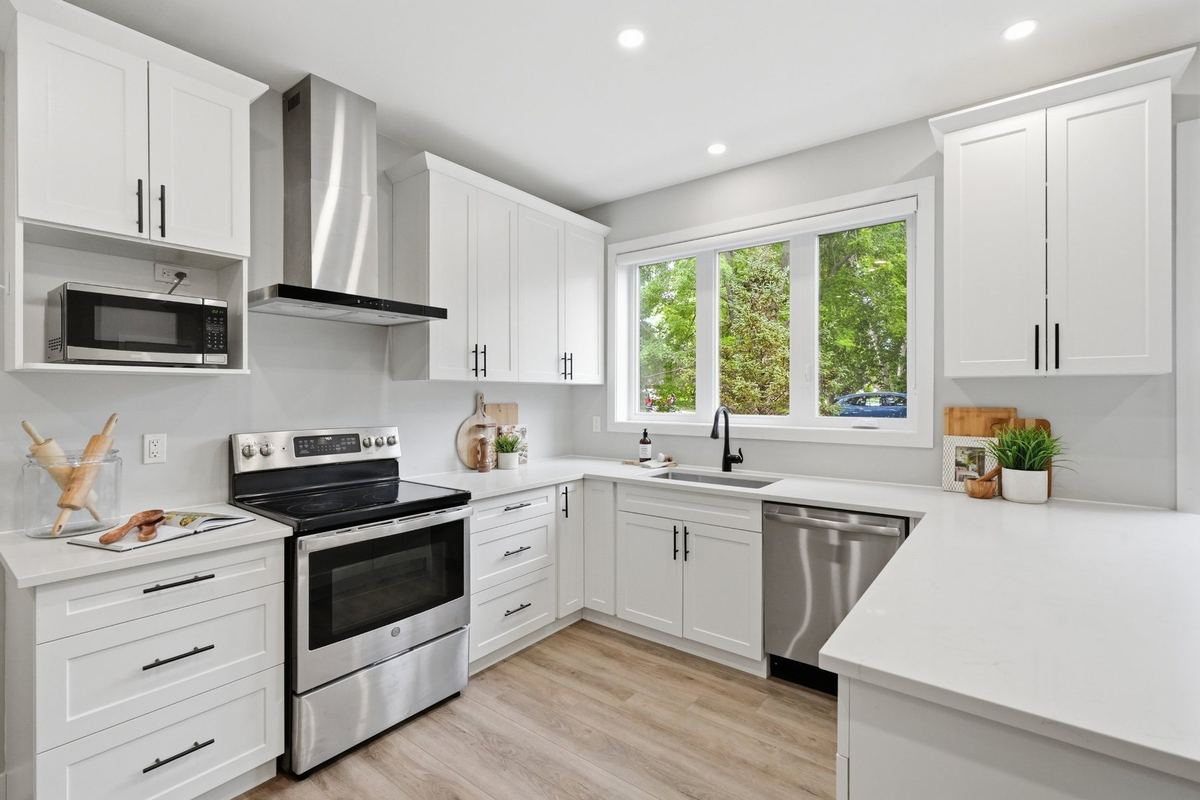 Kitchen with quartz counters and stainless steel appliances